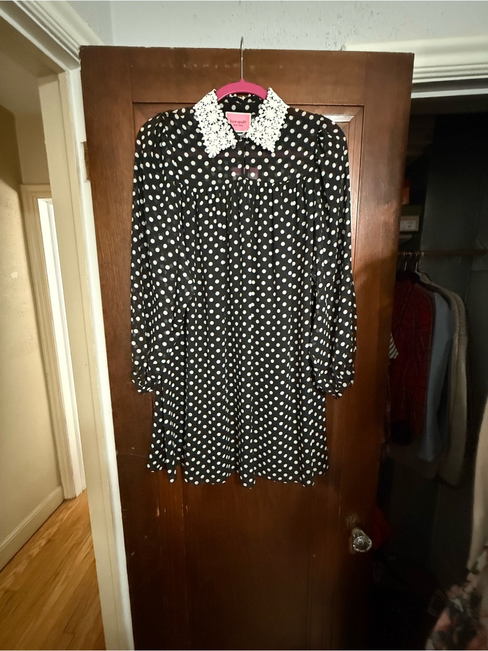 Polka dot swing dress with button sleeves and a lace spread color. New with Tags